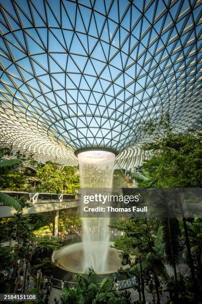 the jewel waterfall at changi airport in singapore - transit at changi singapore stock pictures, royalty-free photos & images