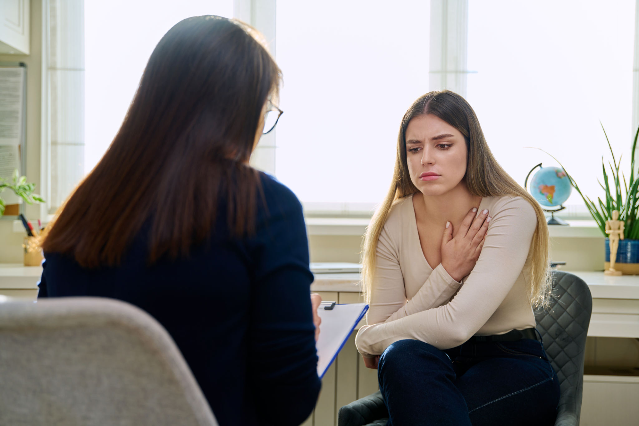 therapist helping patient