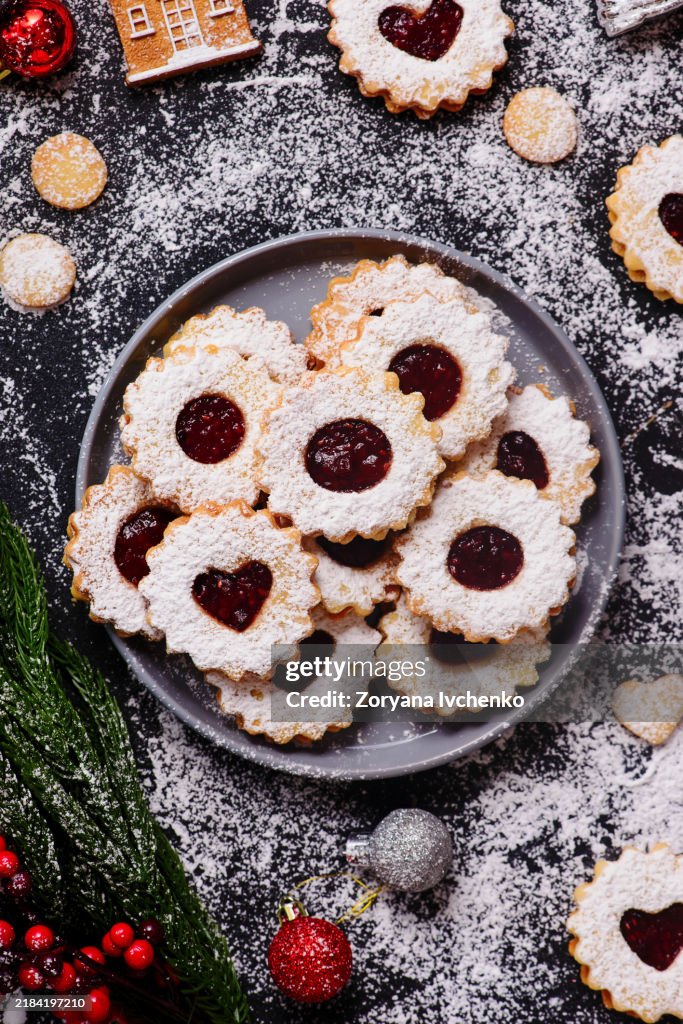 Traditional Christmas Linzer Cookies on a Christmas rustic background