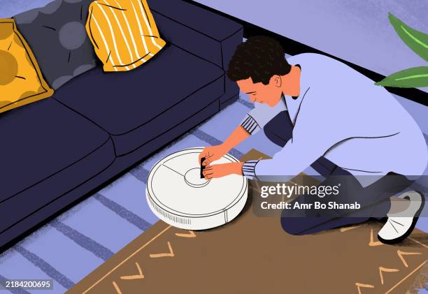 man kneeling on a carpet to repair or set up a robotic vacuum cleaner next to a couch with a striped pillow - tidy up stock illustrations