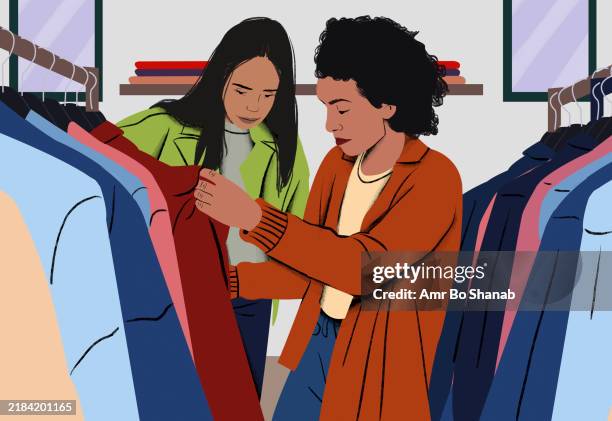 two friends shopping for clothes in a boutique, examining a red jacket on a rack - clothes rack stock illustrations