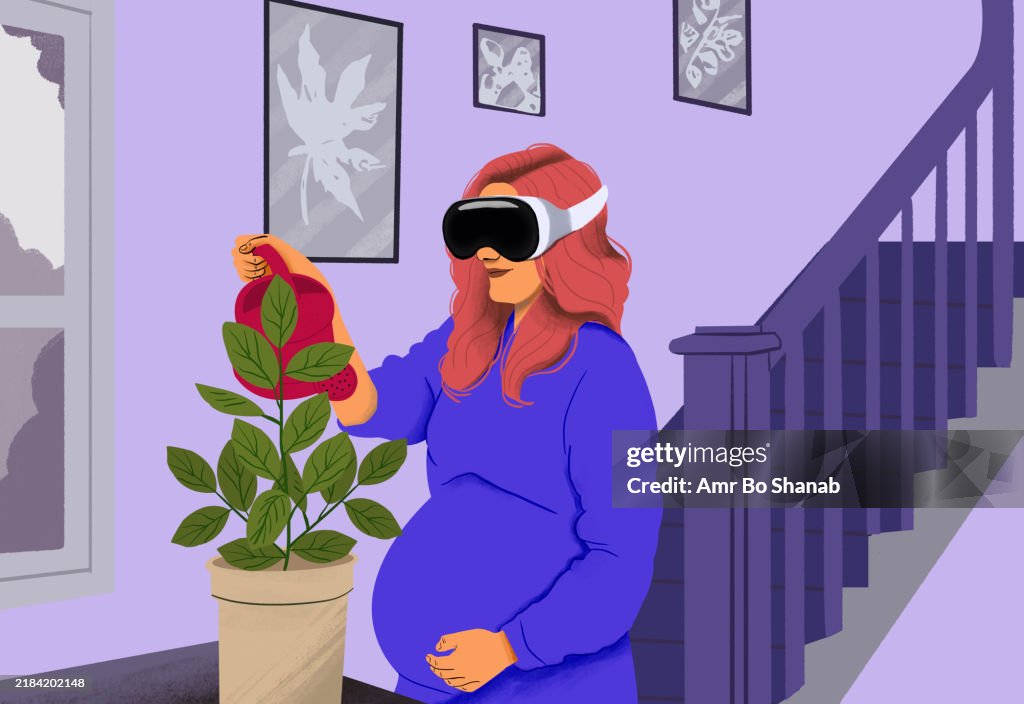 Pregnant woman with red hair experiencing virtual reality next to a house plant and staircase with art on the wall