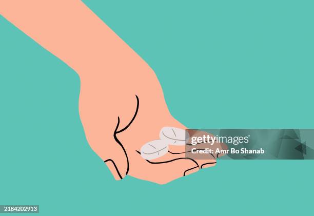 hand holding three pills on a turquoise background - supplements hand stock illustrations
