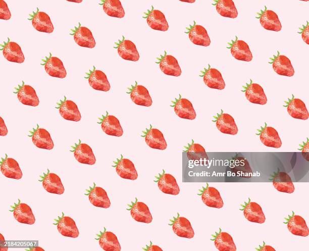 seamless pattern of hand-painted strawberries on a pink background - strawberry background stock illustrations