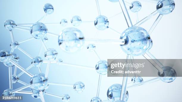 una vista ravvicinata di strutture molecolari incandescenti sotto uno sfondo blu che rappresenta la ricerca scientifica e i concetti di chimica - struttura cellulare foto e immagini stock