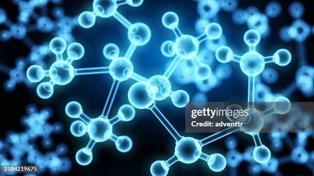 a close-up view of glowing molecular structures under a blue background representing scientific research and chemistry concepts - cell structure stock pictures, royalty-free photos & images