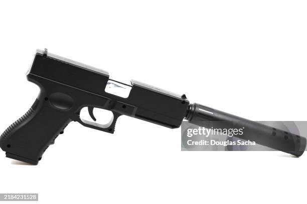 gun isolated on white - revolver-with-silencer stock-fotos und bilder