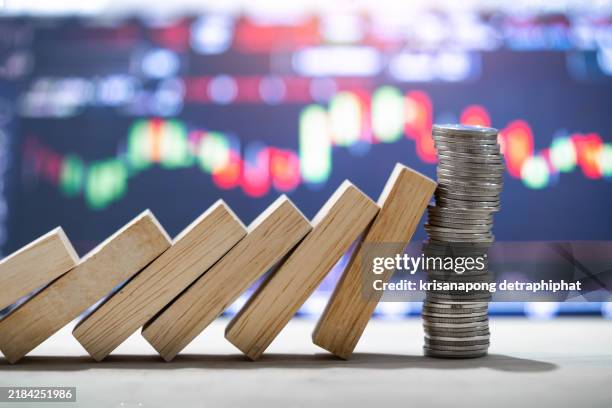 stopping the domino effect concept for business solution, strategy and successful intervention,finance and investment,stock market concept. - interruption stock pictures, royalty-free photos & images