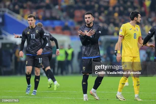 Lumbardh Dellova of Kosovo shows a sign to the Romanian fans during the UEFA Nations League 2024/25 League C Group C2 match between Romania and...