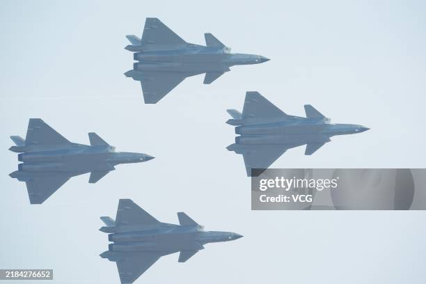 Stealth fighters perform in the sky during the Airshow China 2024 at Zhuhai International Air Show Center on November 12, 2024 in Zhuhai, Guangdong...