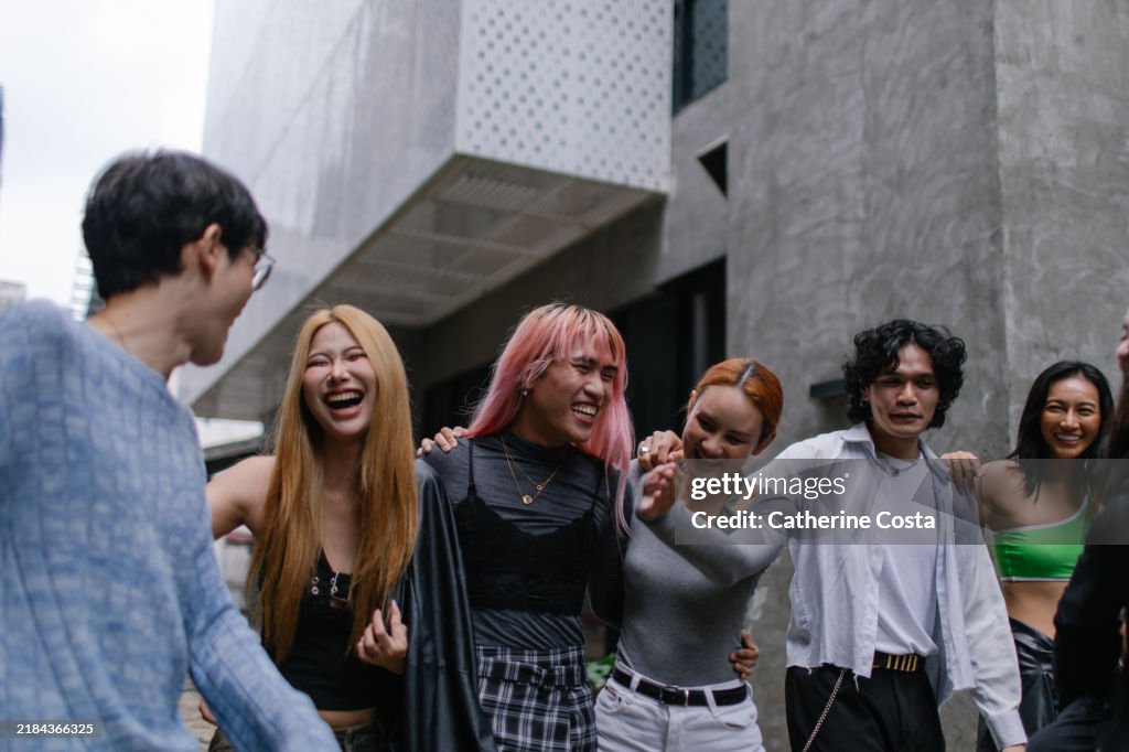 Group of cheerful queer friends at an event - stock photo