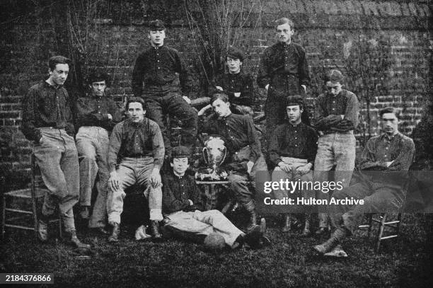 Team photo of William Evans's House football eleven after winning the House Football Cup at Eton College, Berkshire, December 1865. Back row : M...