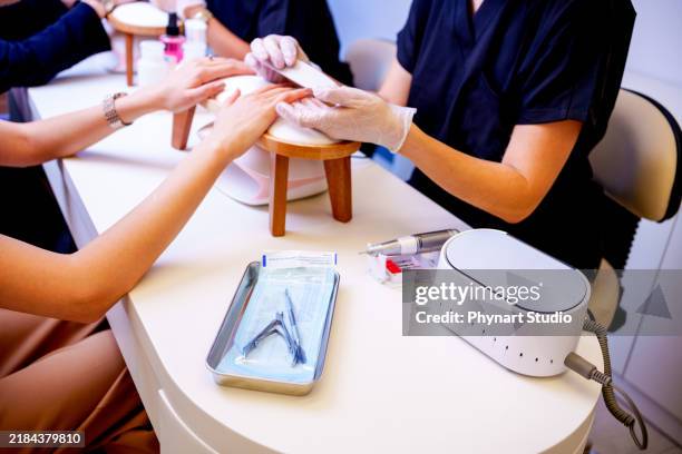 women having manicure at beauty spa - pedicure nail art stock pictures, royalty-free photos & images