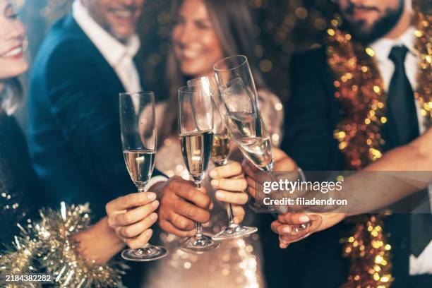 friends celebrating christmas or new year eve. - toost stockfoto's en -beelden