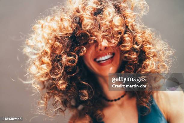 woman with curly hair taking selfie - curly hair stock pictures, royalty-free photos & images