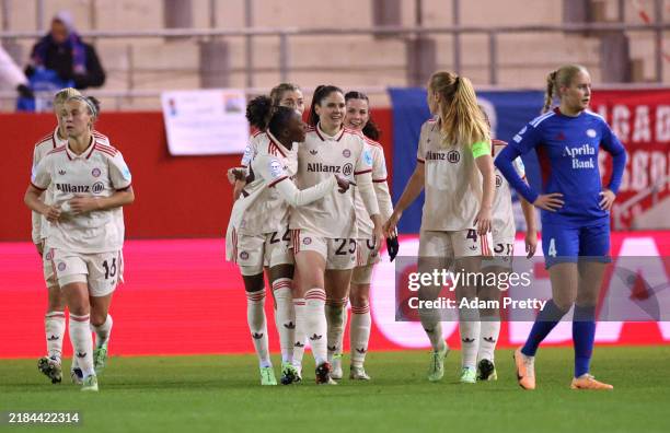 Sarah Zadrazil of Bayern Munich celebrates scoring her team's third goal with teammates during the UEFA Women's Champions League match between FC...
