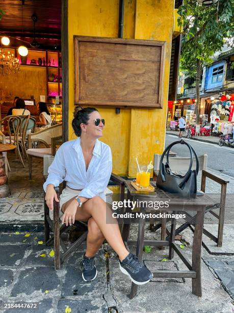 relaxing at a cozy cafe in hoi an - hoi an stockfoto's en -beelden