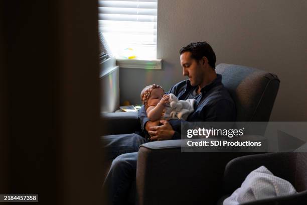Guy Rocking A Baby 45 Rocking Baby At Night Stock Photos, High-Res Pictures, and Images ...