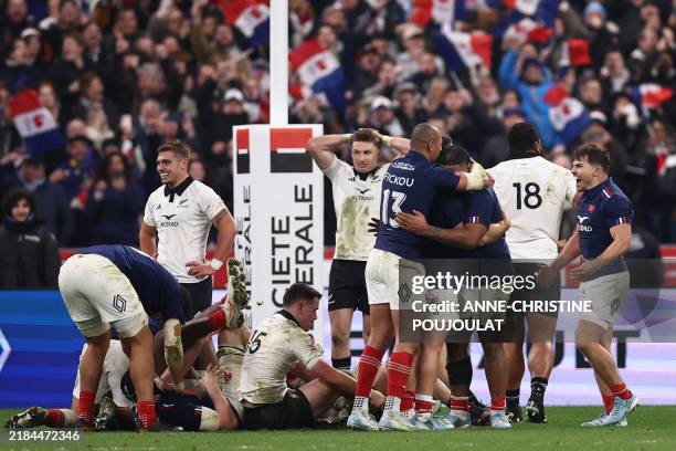 France's players celebrate their victory at the end of the Autumn Nations Series international rugby union test match between France and New Zealand...