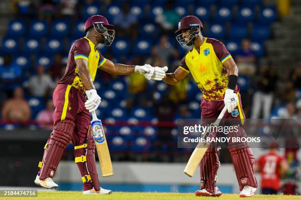 Evin Lewis and Shai Hope of West Indies celebrate their 100-run partnership during the 4th T20I cricket match between England and West Indies and at...