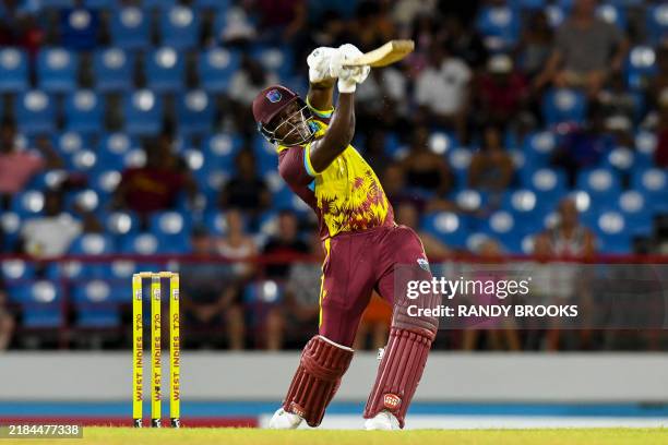 Rovman Powell of West Indies hits 6 during the 4th T20I cricket match between England and West Indies and at Daren Sammy Cricket Ground in Gros...