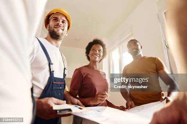 talking about renovation plans! - contractor with customer stock pictures, royalty-free photos & images