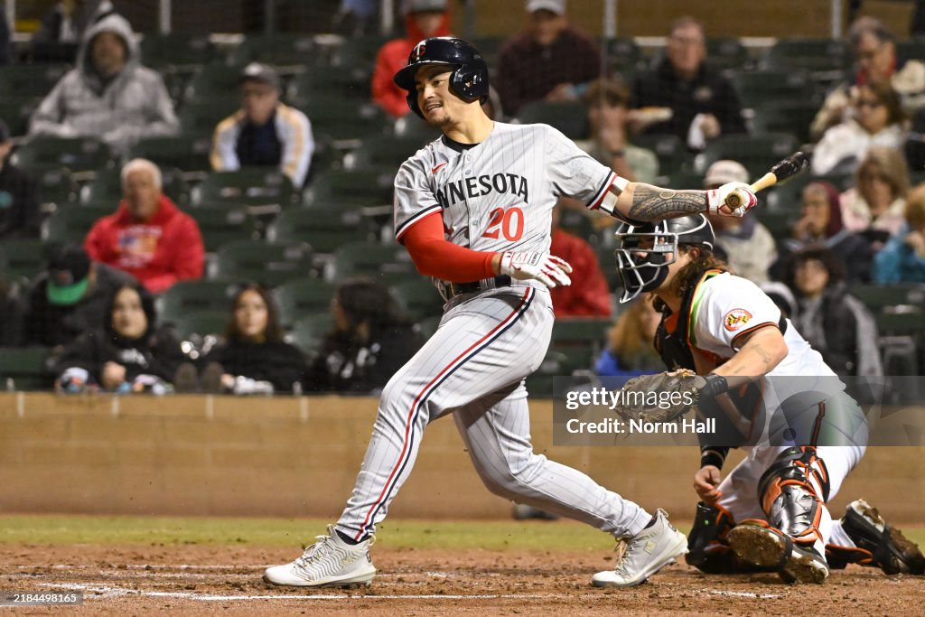 Salt River Rafters Kala'i Rosario of the Salt River Rafters hits an RBI double in the ...