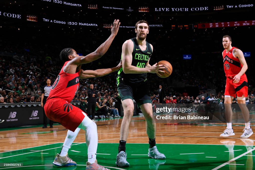 Luke Raptors Luke Kornet of the Boston Celtics looks to pass the ball during the ...