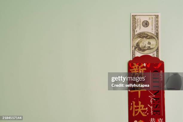 angpao (red envelopes) for chinese new year celebration - chinese script stock pictures, royalty-free photos & images