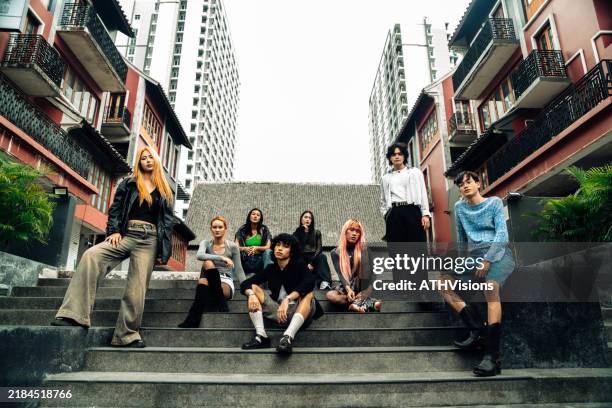 diverse group of trendy friends in urban setting, exuding style and confidence - south east asia stock pictures, royalty-free photos & images
