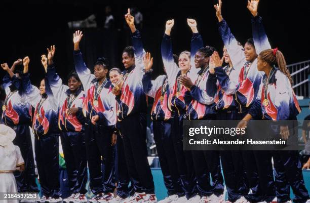 The US women's basketball team celebrates during the women's basketball event medal ceremony, after the gold-medal game between Brazil and the USA,...
