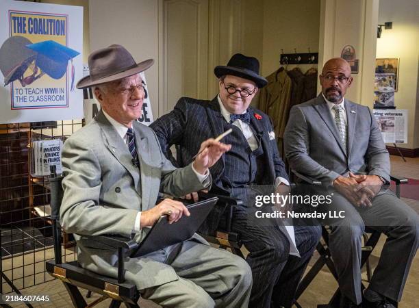 Winston Churchill historical interpreter Luke Boyd is flanked by Franklin Roosevelt interpreter Gary Stamm, left, and retired Colonel Jason Halloren...