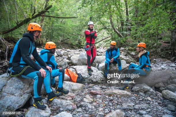 canyoning instructions from caucasian guide - canyon stock pictures, royalty-free photos & images