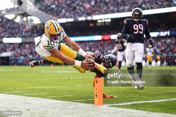 Jordan Love of the Green Bay Packers dives at the pylon with the ball during the second half of an NFL football game against the Chicago Bears at...