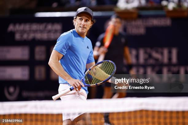 Diego Forlan, the 45-year-old former Manchester United, Uruguay, and Atletico Madrid footballer playing in his pro tennis debut, pauses during his...