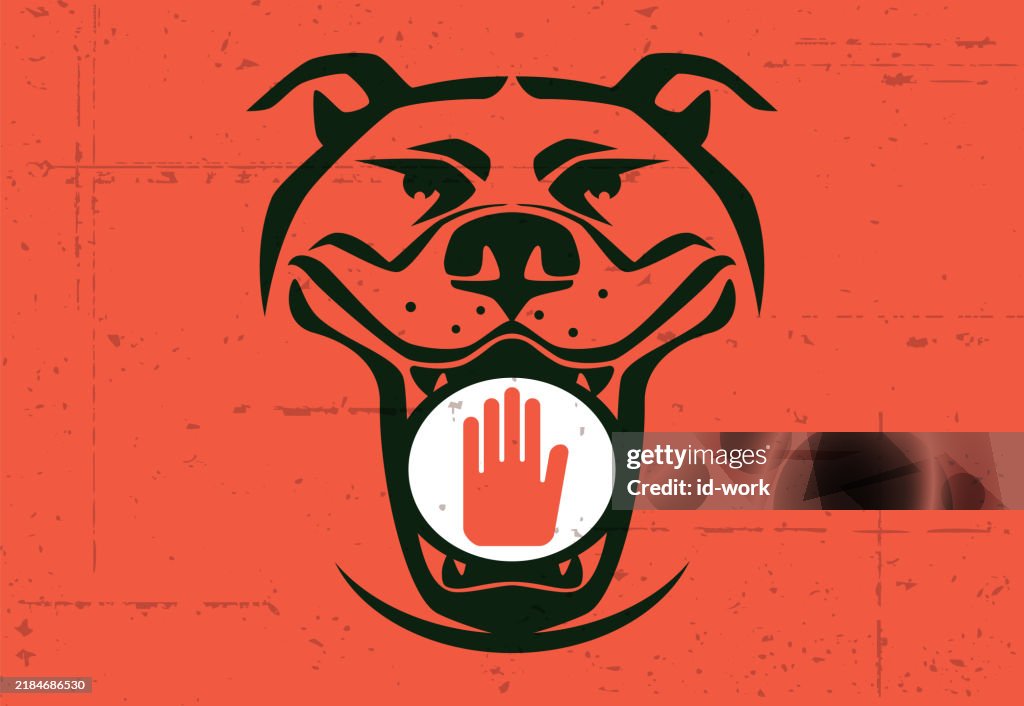 Angry dog holding stop sign