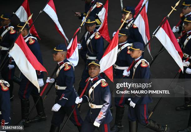 Members of the honor guard leave after the arrivals of delegates on the first day of the G20 Summit in Rio de Janeiro on November 18, 2024.