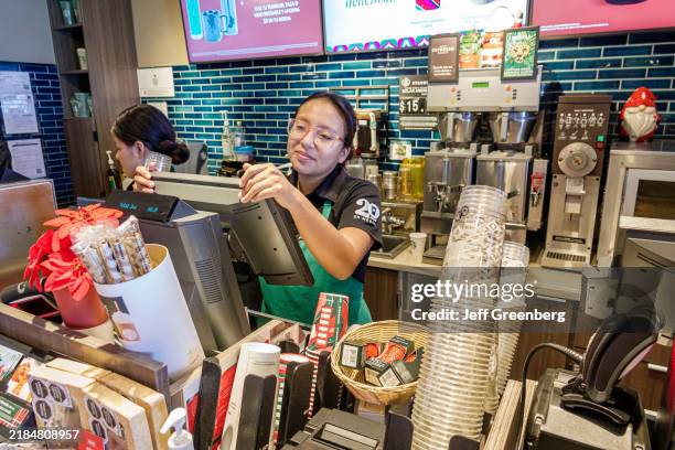 Cozumel, Mexico, Starbucks Coffee Punta Langosta, Avenida Rafael Melgar, barista taking drink order.