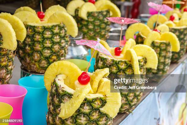 Miami Beach, Florida, Lummus Park, Ocean Drive, Art Deco Weekend, street fair food vendor, pineapple drink pina colada.