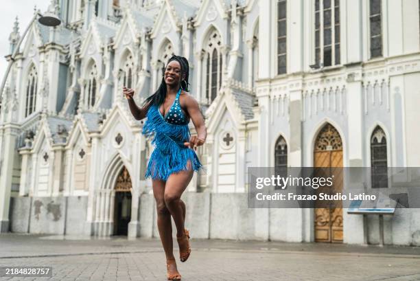 portrait of a mid adult woman dancer dancing salsa in cali, colombia - cali colombia stock pictures, royalty-free photos & images