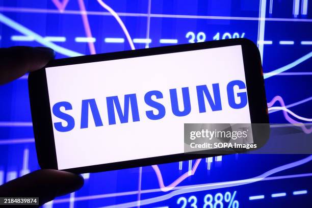 In this photo illustration, the Samsung Group company logo is seen displayed on a smartphone screen.