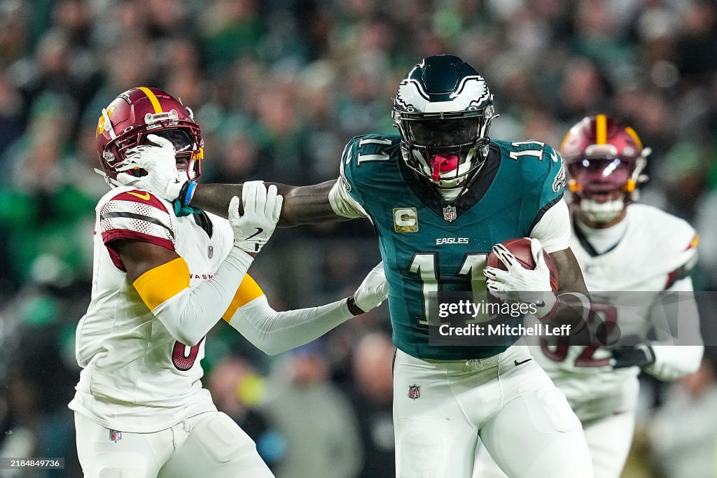 Mike Commanders Mike Sainristil of the Washington Commanders defends A.J. Brown of ...
