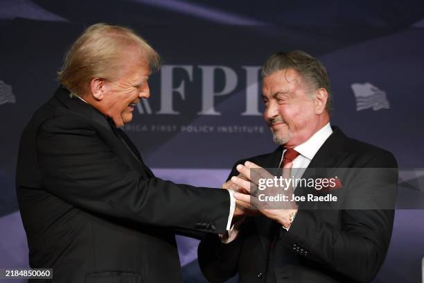 President-elect Donald Trump greets actor Sylvester Stallone onstage at the America First Policy Institute Gala held at Mar-a-Lago on November 14,...