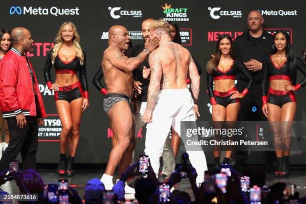 Mike Tyson slaps Jake Paul as they face off during their ceremonial weigh-in at The Pavilion at Toyota Music Factory on November 14, 2024 in Irving,...