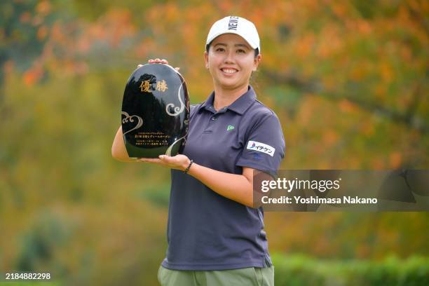 Nana Yamashiro of Japan poses with the trophy after winning the tournament following the final round of Kyoto Ladies Open at Joyo Country Club on...