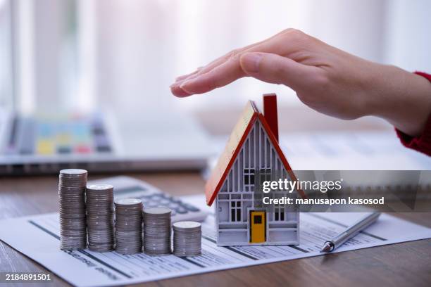 real estate investment and loan, mortgage and refinance concept. - homeowners insurance stock pictures, royalty-free photos & images