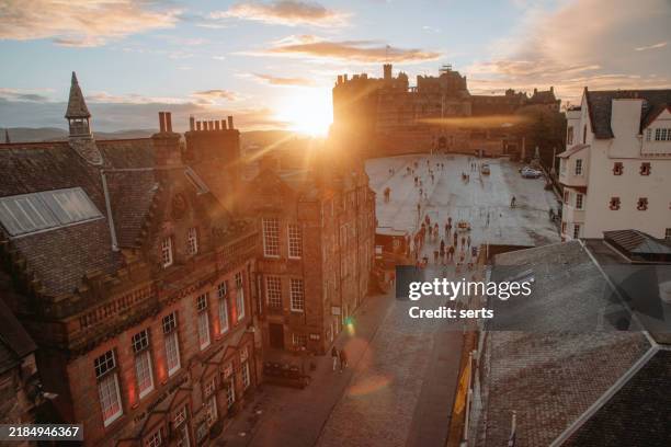 aerial view of edinburgh castle and castle hill square at sunset in autumn - edinburgh castle esplanade stock pictures, royalty-free photos & images
