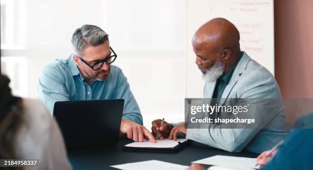 people, writing and paper in office for business, contract renewal and sign company nda at tech. corporate, men and advice in boardroom for financial agreement, investment proposal or legal process - non disclosure agreement stock pictures, royalty-free photos & images
