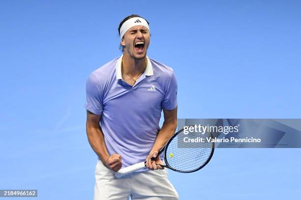 Alexander Zverev of Germany celebrates a straight sets victory over Carlos Alcaraz of Spain in their men's singles match on day six of the Nitto ATP...
