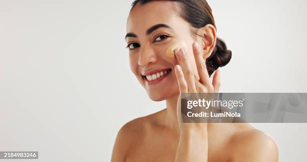 portrait, woman and happy with beauty, foundation and moisturizer for application on white background. female person, confidence and product for makeup, cosmetology or hygiene in wellness or skincare - imagem a cores imagens e fotografias de stock